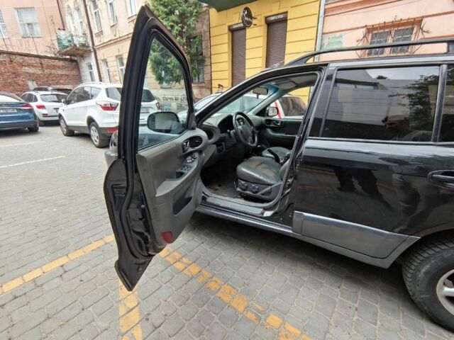 Черный Хендай Санта Фе, объемом двигателя 2.4 л и пробегом 240 тыс. км за 4400 $, фото 3 на Automoto.ua