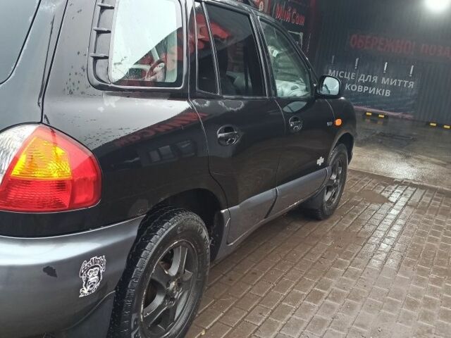 Чорний Хендай Санта Фе, об'ємом двигуна 2 л та пробігом 345 тис. км за 2700 $, фото 2 на Automoto.ua