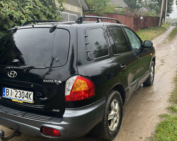Черный Хендай Санта Фе, объемом двигателя 2 л и пробегом 271 тыс. км за 4000 $, фото 3 на Automoto.ua