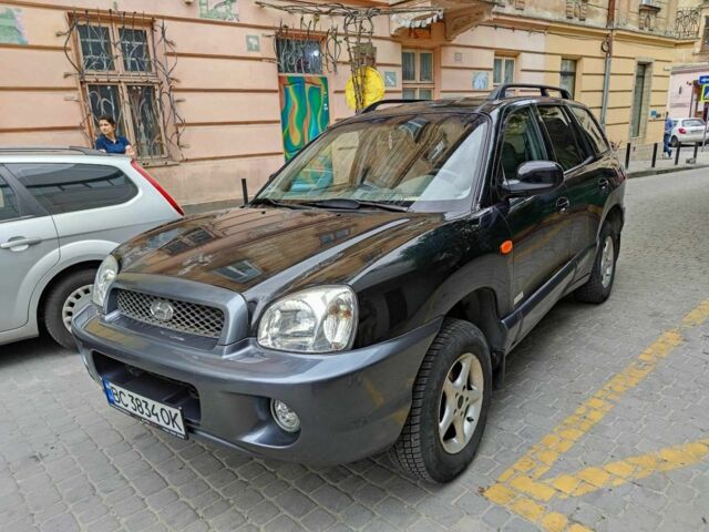 Черный Хендай Санта Фе, объемом двигателя 2.4 л и пробегом 240 тыс. км за 4400 $, фото 1 на Automoto.ua