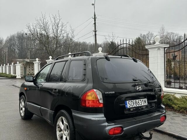 Чорний Хендай Санта Фе, об'ємом двигуна 2 л та пробігом 300 тис. км за 2700 $, фото 3 на Automoto.ua