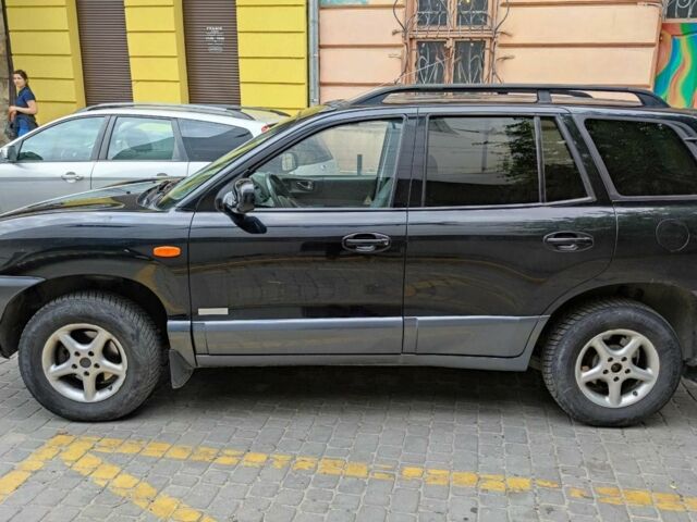 Черный Хендай Санта Фе, объемом двигателя 2.4 л и пробегом 240 тыс. км за 4400 $, фото 2 на Automoto.ua