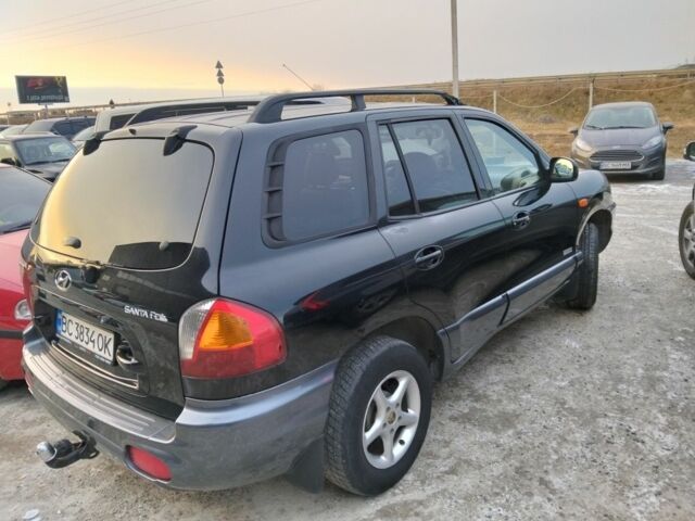 Черный Хендай Санта Фе, объемом двигателя 2.4 л и пробегом 240 тыс. км за 4400 $, фото 9 на Automoto.ua