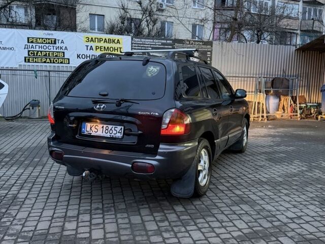 Черный Хендай Санта Фе, объемом двигателя 2 л и пробегом 340 тыс. км за 3500 $, фото 2 на Automoto.ua