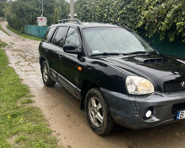 Черный Хендай Санта Фе, объемом двигателя 2 л и пробегом 271 тыс. км за 4000 $, фото 2 на Automoto.ua