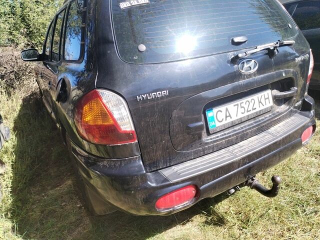 Черный Хендай Санта Фе, объемом двигателя 2.4 л и пробегом 295 тыс. км за 3100 $, фото 2 на Automoto.ua