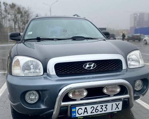 Чорний Хендай Санта Фе, об'ємом двигуна 1.99 л та пробігом 360 тис. км за 6400 $, фото 1 на Automoto.ua