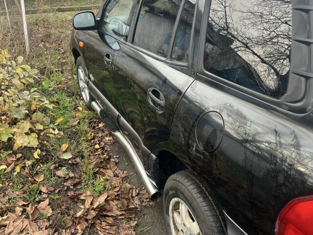 Черный Хендай Санта Фе, объемом двигателя 2.4 л и пробегом 240 тыс. км за 1900 $, фото 7 на Automoto.ua