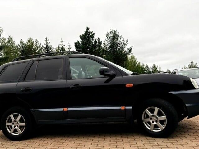 Черный Хендай Санта Фе, объемом двигателя 2.2 л и пробегом 244 тыс. км за 2200 $, фото 3 на Automoto.ua