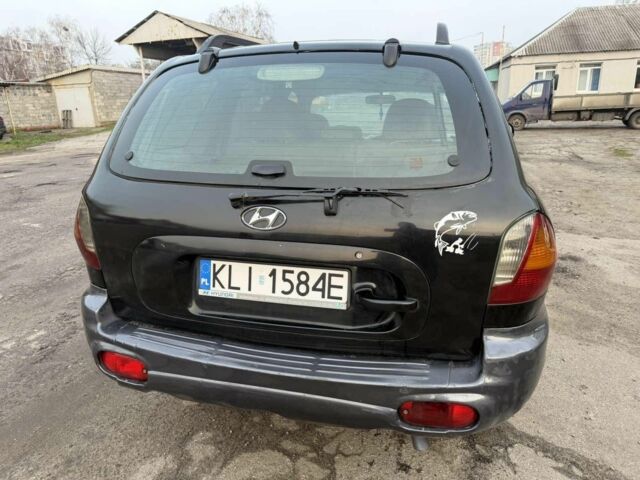 Черный Хендай Санта Фе, объемом двигателя 2 л и пробегом 283 тыс. км за 3300 $, фото 4 на Automoto.ua