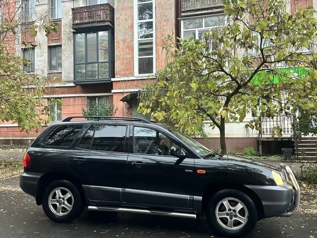 Черный Хендай Санта Фе, объемом двигателя 2 л и пробегом 323 тыс. км за 4268 $, фото 1 на Automoto.ua