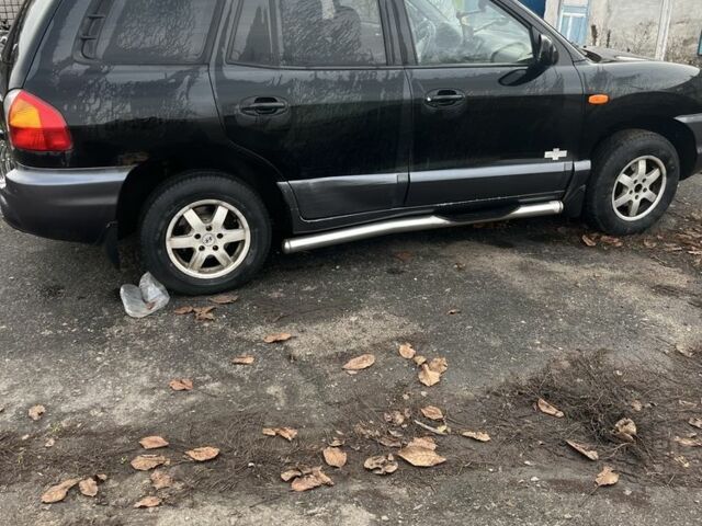 Черный Хендай Санта Фе, объемом двигателя 2.4 л и пробегом 240 тыс. км за 1900 $, фото 1 на Automoto.ua