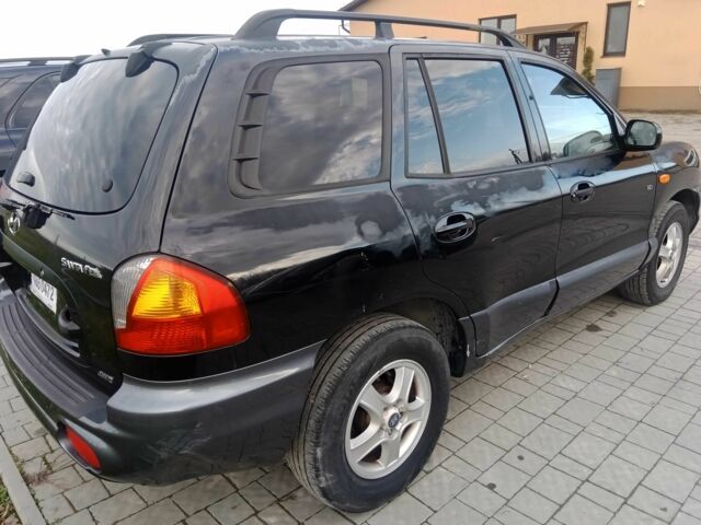 Черный Хендай Санта Фе, объемом двигателя 2.2 л и пробегом 330 тыс. км за 3844 $, фото 4 на Automoto.ua