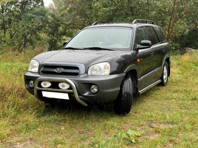 Черный Хендай Санта Фе, объемом двигателя 2 л и пробегом 273 тыс. км за 3500 $, фото 1 на Automoto.ua
