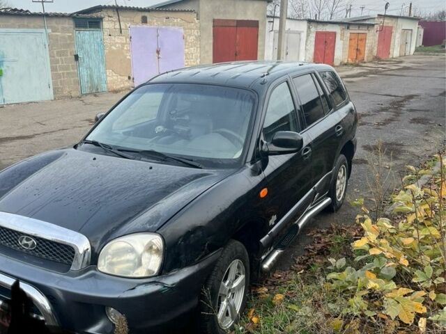 Черный Хендай Санта Фе, объемом двигателя 2.4 л и пробегом 240 тыс. км за 1900 $, фото 4 на Automoto.ua