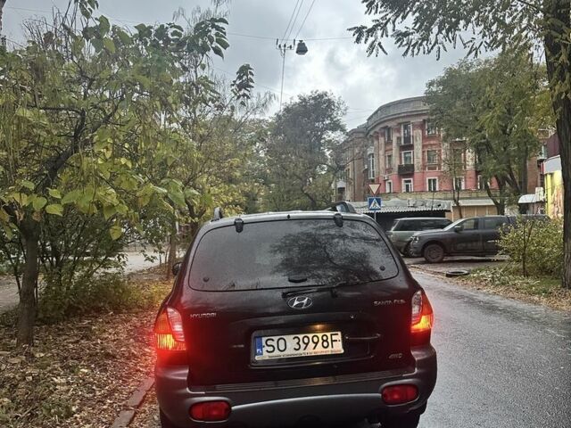 Черный Хендай Санта Фе, объемом двигателя 2 л и пробегом 323 тыс. км за 4268 $, фото 2 на Automoto.ua