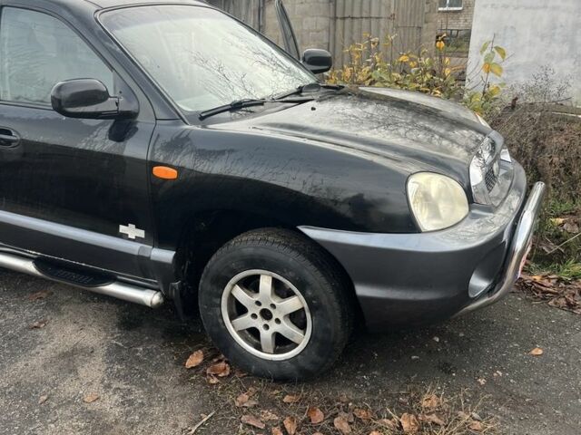 Черный Хендай Санта Фе, объемом двигателя 2.4 л и пробегом 240 тыс. км за 1900 $, фото 2 на Automoto.ua