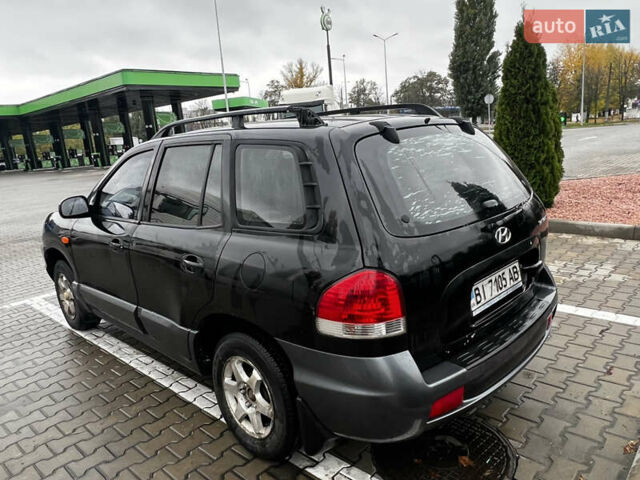 Черный Хендай Санта Фе, объемом двигателя 2 л и пробегом 270 тыс. км за 4300 $, фото 4 на Automoto.ua