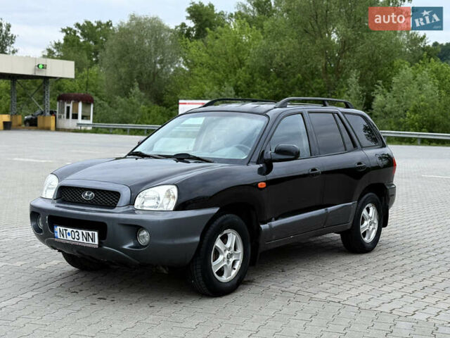 Черный Хендай Санта Фе, объемом двигателя 2 л и пробегом 300 тыс. км за 3600 $, фото 2 на Automoto.ua