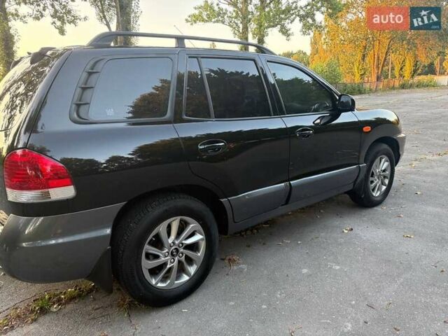 Черный Хендай Санта Фе, объемом двигателя 2.4 л и пробегом 175 тыс. км за 6800 $, фото 2 на Automoto.ua