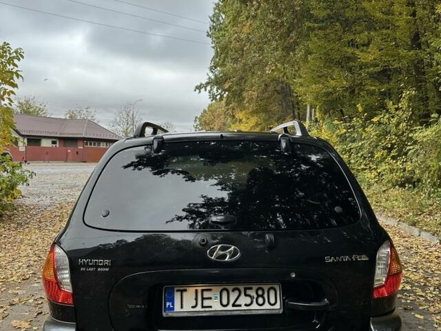 Черный Хендай Санта Фе, объемом двигателя 2 л и пробегом 400 тыс. км за 3300 $, фото 5 на Automoto.ua