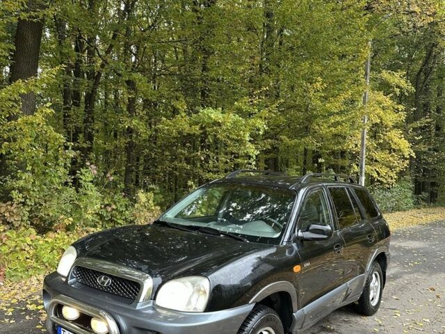 Черный Хендай Санта Фе, объемом двигателя 2 л и пробегом 400 тыс. км за 3300 $, фото 1 на Automoto.ua