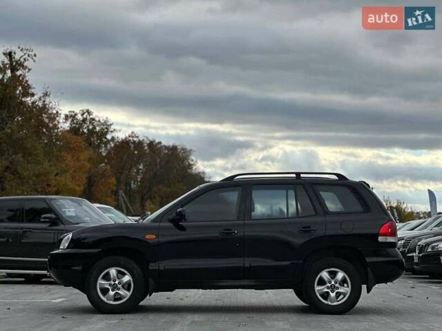 Чорний Хендай Санта Фе, об'ємом двигуна 2.7 л та пробігом 231 тис. км за 5990 $, фото 4 на Automoto.ua