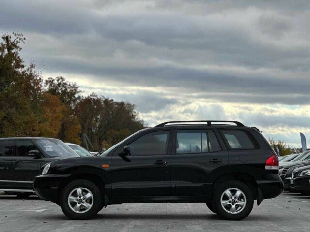 Чорний Хендай Санта Фе, об'ємом двигуна 2.7 л та пробігом 231 тис. км за 6490 $, фото 4 на Automoto.ua