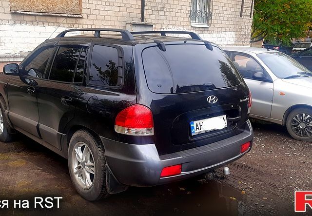 Черный Хендай Санта Фе, объемом двигателя 2.4 л и пробегом 330 тыс. км за 6300 $, фото 1 на Automoto.ua