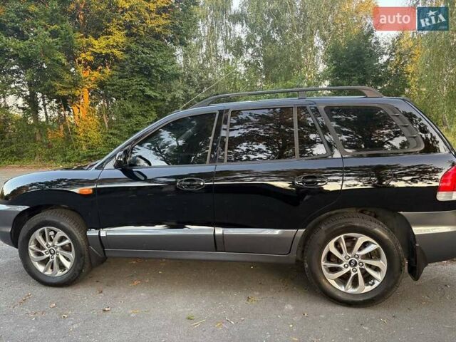 Черный Хендай Санта Фе, объемом двигателя 2.4 л и пробегом 175 тыс. км за 6800 $, фото 9 на Automoto.ua