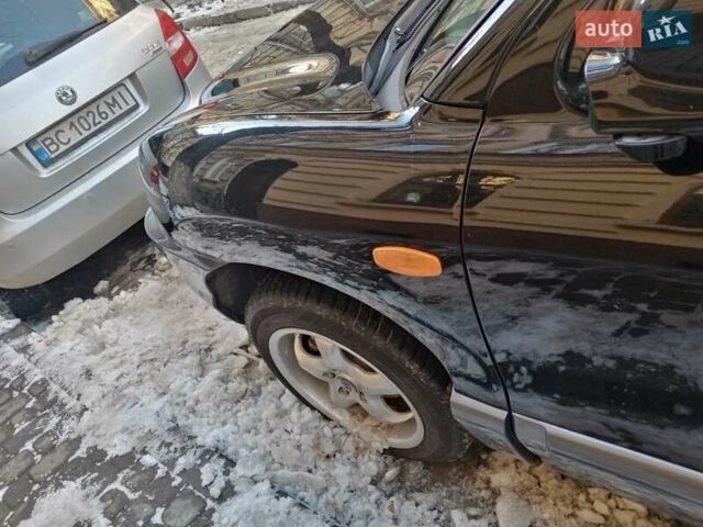 Черный Хендай Санта Фе, объемом двигателя 2 л и пробегом 194 тыс. км за 7500 $, фото 3 на Automoto.ua