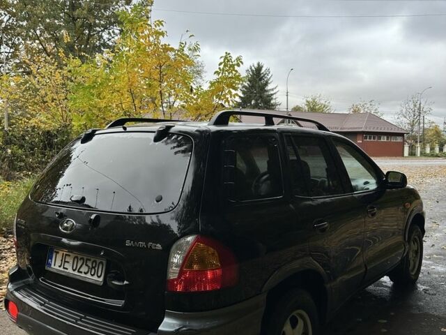 Черный Хендай Санта Фе, объемом двигателя 2 л и пробегом 400 тыс. км за 3300 $, фото 6 на Automoto.ua