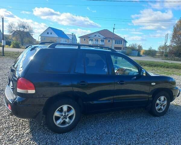 Черный Хендай Санта Фе, объемом двигателя 2.35 л и пробегом 313 тыс. км за 5500 $, фото 5 на Automoto.ua