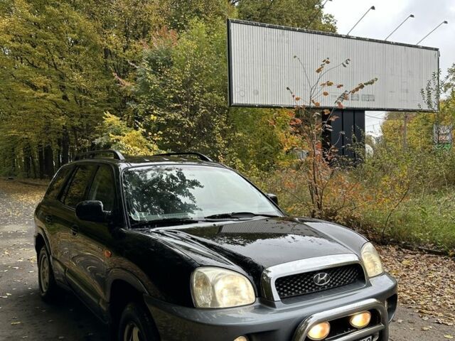 Черный Хендай Санта Фе, объемом двигателя 2 л и пробегом 400 тыс. км за 3300 $, фото 3 на Automoto.ua