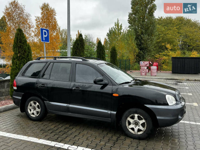 Черный Хендай Санта Фе, объемом двигателя 2 л и пробегом 270 тыс. км за 4300 $, фото 3 на Automoto.ua
