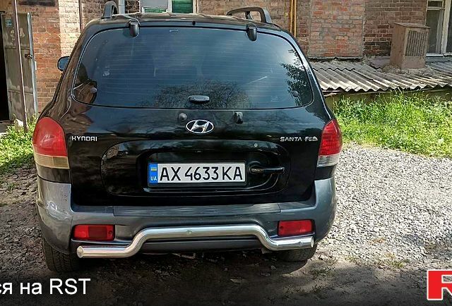 Черный Хендай Санта Фе, объемом двигателя 2 л и пробегом 200 тыс. км за 5100 $, фото 1 на Automoto.ua