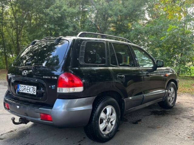 Черный Хендай Санта Фе, объемом двигателя 2 л и пробегом 350 тыс. км за 3000 $, фото 2 на Automoto.ua