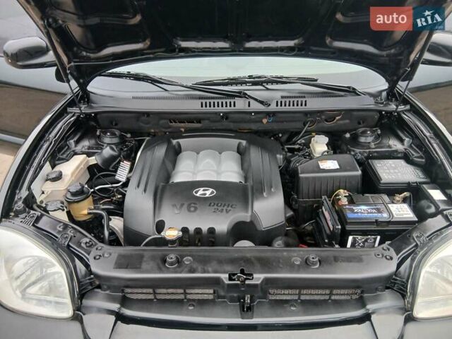 Черный Хендай Санта Фе, объемом двигателя 2.66 л и пробегом 195 тыс. км за 5699 $, фото 56 на Automoto.ua