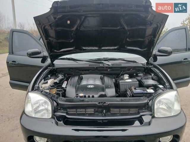 Черный Хендай Санта Фе, объемом двигателя 2.66 л и пробегом 195 тыс. км за 5699 $, фото 57 на Automoto.ua
