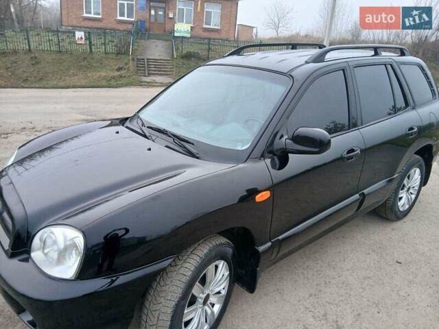 Черный Хендай Санта Фе, объемом двигателя 2.66 л и пробегом 195 тыс. км за 5699 $, фото 5 на Automoto.ua