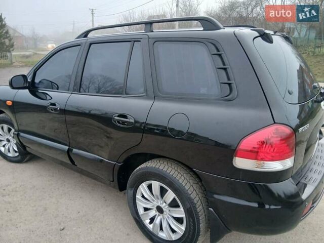 Черный Хендай Санта Фе, объемом двигателя 2.66 л и пробегом 195 тыс. км за 5699 $, фото 9 на Automoto.ua