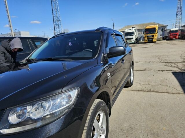 Черный Хендай Санта Фе, объемом двигателя 2.7 л и пробегом 238 тыс. км за 10000 $, фото 1 на Automoto.ua