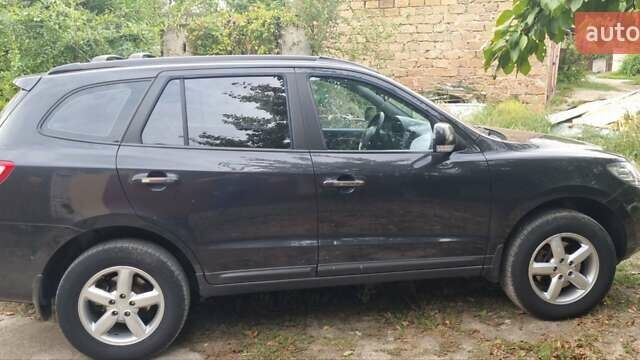 Черный Хендай Санта Фе, объемом двигателя 2.66 л и пробегом 141 тыс. км за 10600 $, фото 1 на Automoto.ua