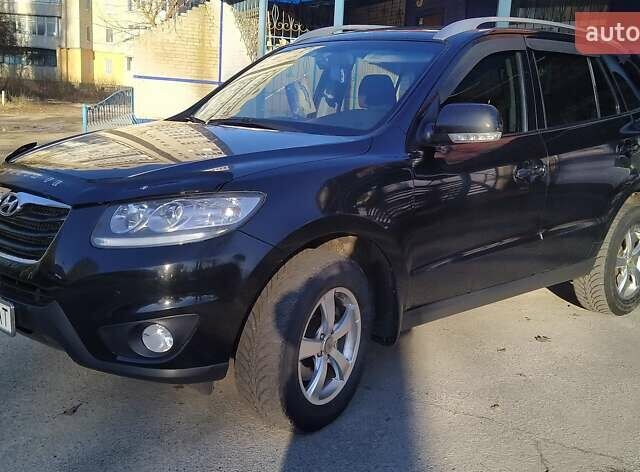 Черный Хендай Санта Фе, объемом двигателя 2.4 л и пробегом 195 тыс. км за 11250 $, фото 3 на Automoto.ua