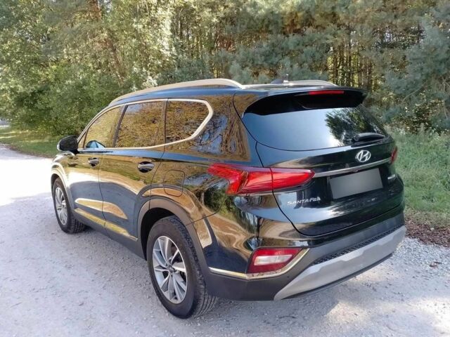 Черный Хендай Санта Фе, объемом двигателя 2.4 л и пробегом 106 тыс. км за 11999 $, фото 1 на Automoto.ua