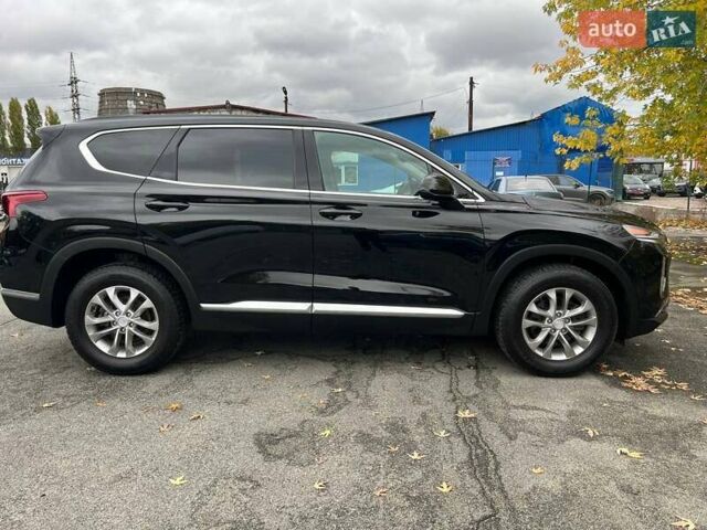 Черный Хендай Санта Фе, объемом двигателя 2.36 л и пробегом 150 тыс. км за 19900 $, фото 6 на Automoto.ua