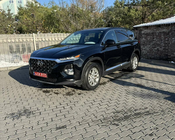 Черный Хендай Санта Фе, объемом двигателя 2.4 л и пробегом 49 тыс. км за 23000 $, фото 1 на Automoto.ua