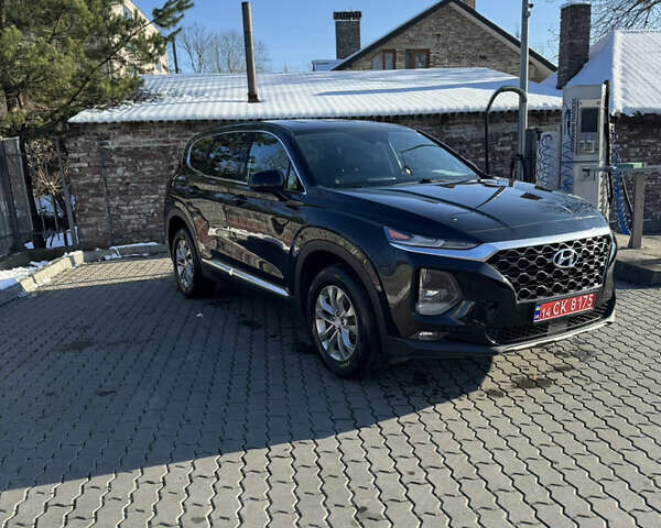 Черный Хендай Санта Фе, объемом двигателя 2.4 л и пробегом 49 тыс. км за 23000 $, фото 2 на Automoto.ua