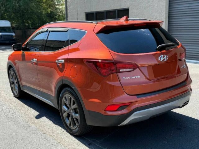 Красный Хендай Санта Фе, объемом двигателя 2 л и пробегом 50 тыс. км за 12500 $, фото 7 на Automoto.ua