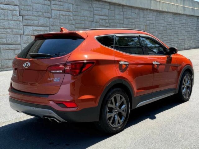 Красный Хендай Санта Фе, объемом двигателя 2 л и пробегом 50 тыс. км за 12500 $, фото 5 на Automoto.ua